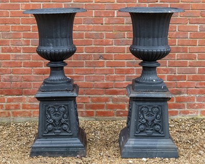 Lot A pair of antique garden urns on decorative plinths