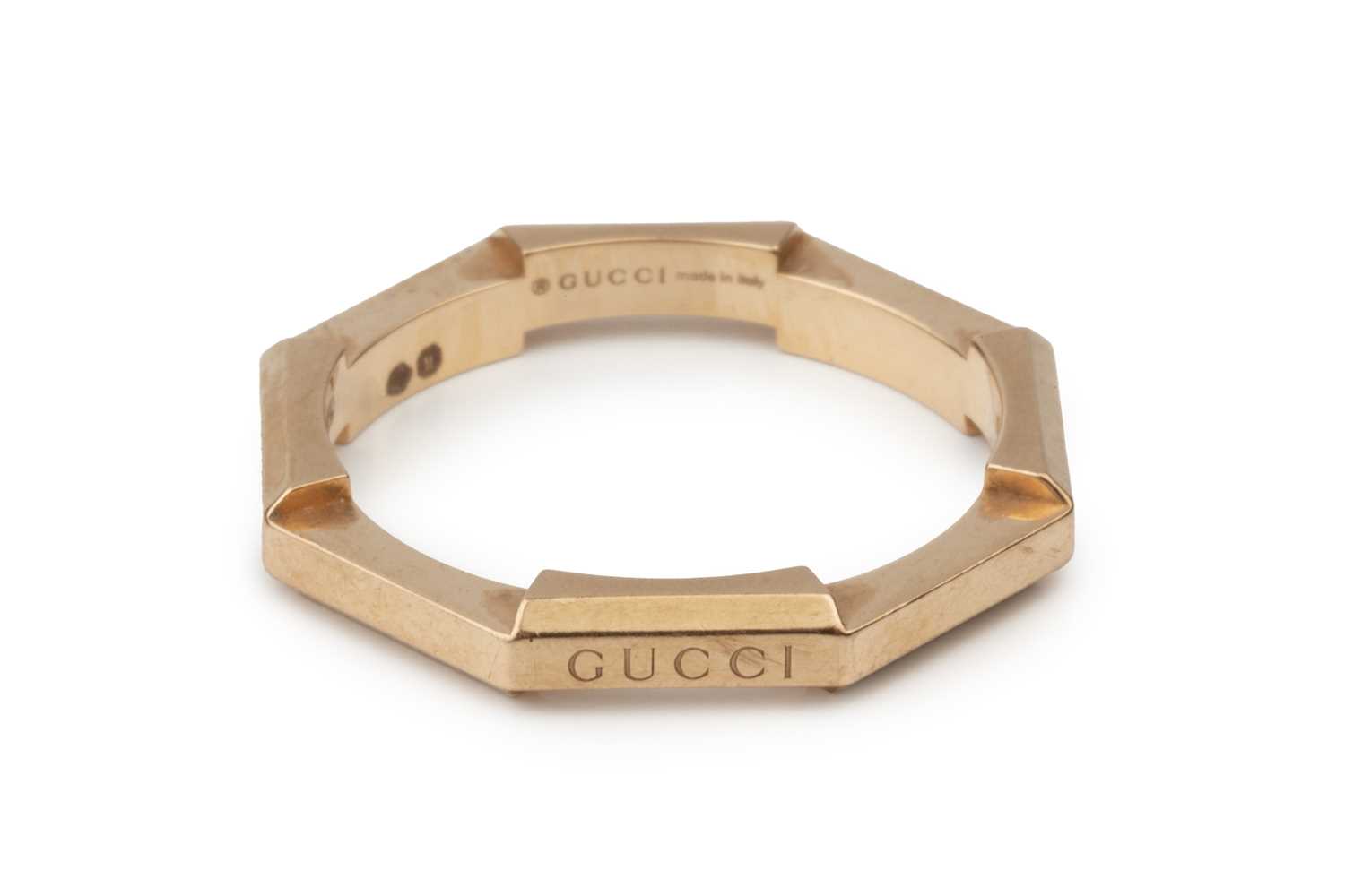 Lot An 18ct yellow gold wedding band by Gucci, of...