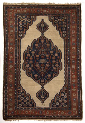 Lot 329 - An antique Persian Serab rug with a banded...