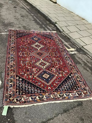 Lot 380 - A modern Isfahan red ground rug with five...