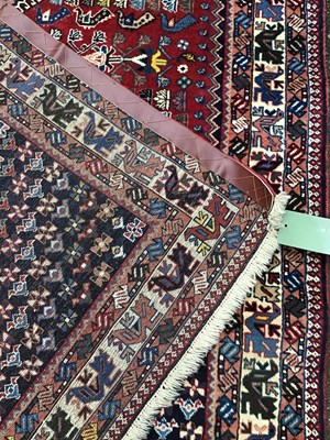Lot 380 - A modern Isfahan red ground rug with five...