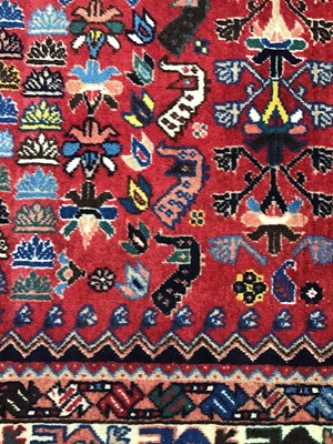 Lot 380 - A modern Isfahan red ground rug with five...