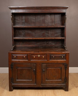 Lot 1021 - An 18th century, possibly North Country oak dresser