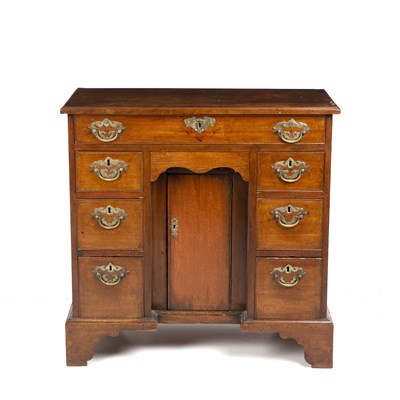 Lot 386 - A George III mahogany kneehole desk with brass...