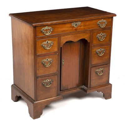 Lot 386 - A George III mahogany kneehole desk with brass...