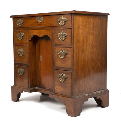 Lot 386 - A George III mahogany kneehole desk with brass...
