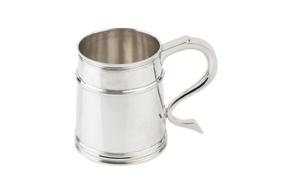 Lot 842 - A silver pint mug, the tapered girdled body...