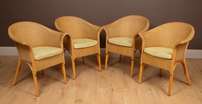 Lot 168 - A set of four Lloyd Loom open armchairs