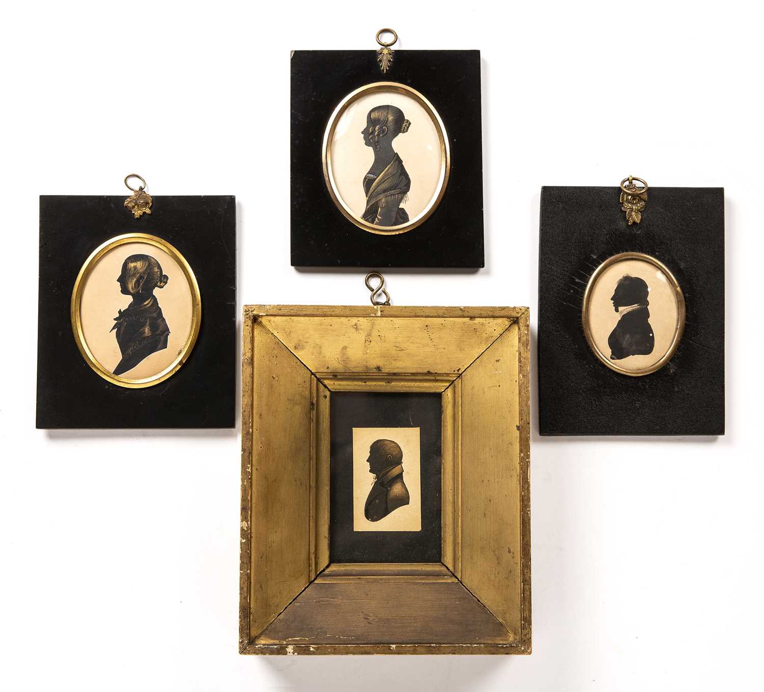 Lot 397 - Four 19th century painted portrait silhouettes...