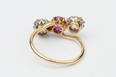 Lot 145 - A ruby and diamond three stone ring, the...