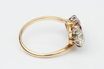 Lot 145 - A ruby and diamond three stone ring, the...
