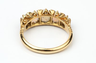 Lot 148 - An opal and diamond five stone ring, the...