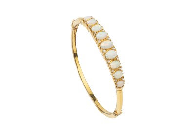 Lot 149 - An opal and diamond set hinged bangle, the...