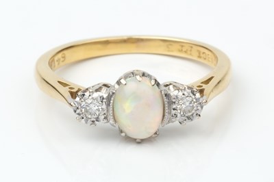 Lot 157 - An opal and diamond three stone ring, the...