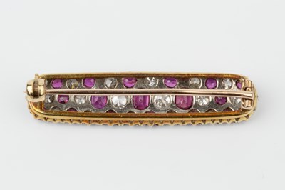 Lot 154 - A ruby and diamond panel brooch, of slightly...