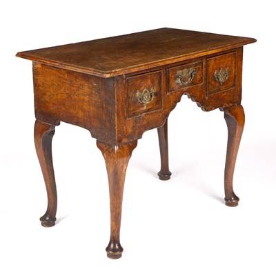 Lot 405 - An 18th century walnut low boy with three...