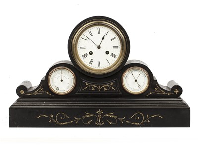 Lot 260 - A 19th century French polished slate mantel...