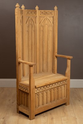 Lot 250 - A Gothic Arts and Crafts hand-carved oak throne chair