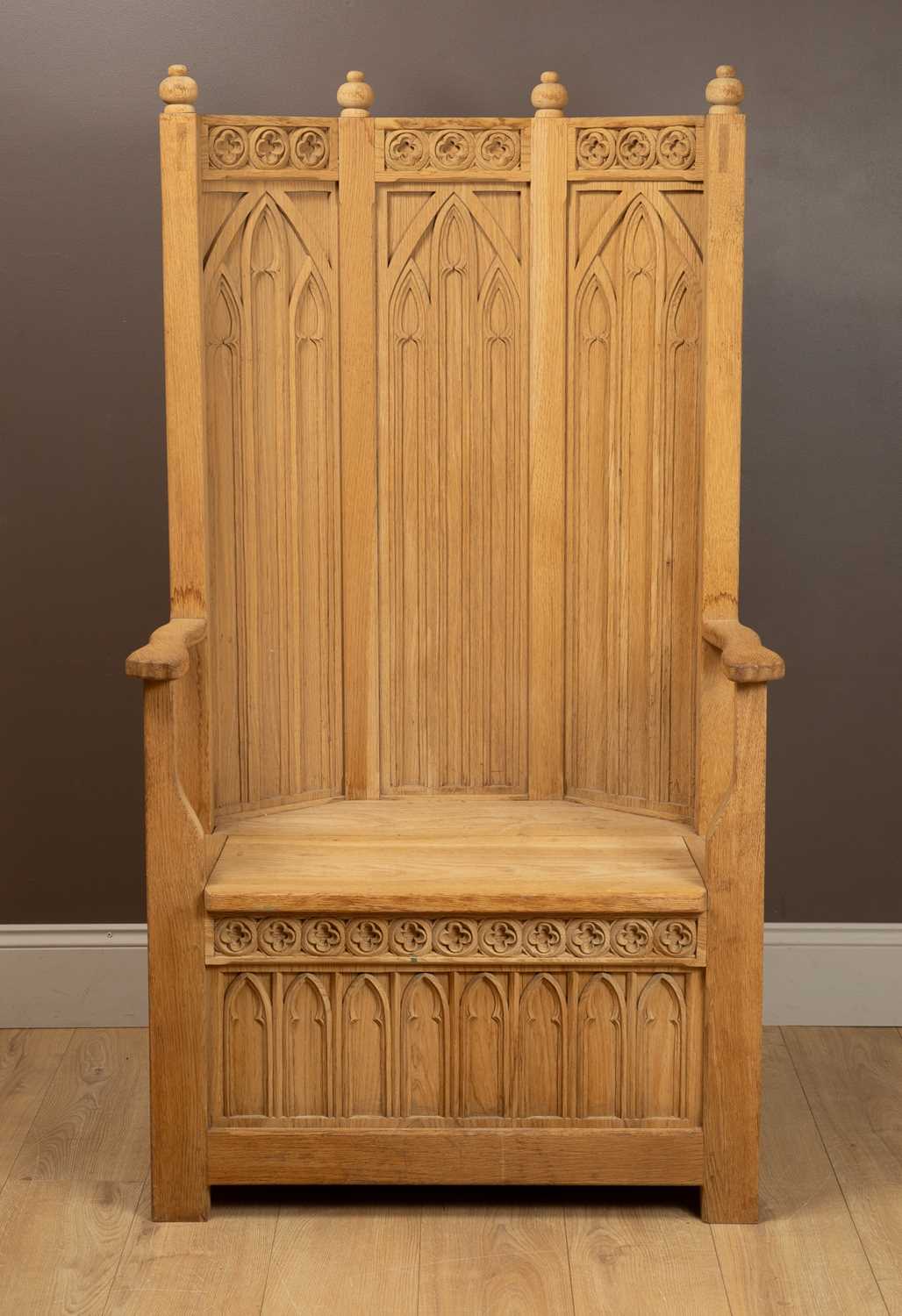 Lot 250 - A Gothic Arts and Crafts hand-carved oak throne chair