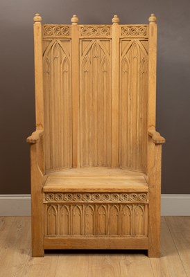 Lot 250 - A Gothic Arts and Crafts hand-carved oak throne chair