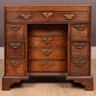 Lot 409 - A hardwood possibly Colonial kneehole desk