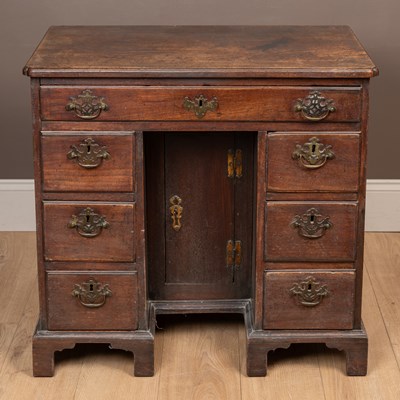 Lot 219 - A George II mahogany knee hole desk