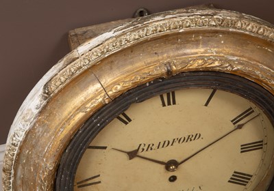 Lot 133 - A gilt circular dial wall clock
