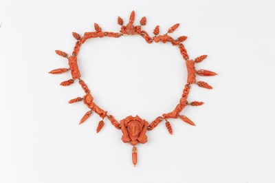 Lot 162 - A suite of carved coral jewellery, comprising...