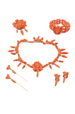 Lot 162 - A suite of carved coral jewellery, comprising...