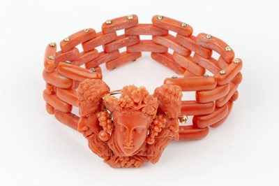 Lot 162 - A suite of carved coral jewellery, comprising...