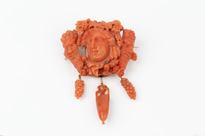 Lot 162 - A suite of carved coral jewellery, comprising...