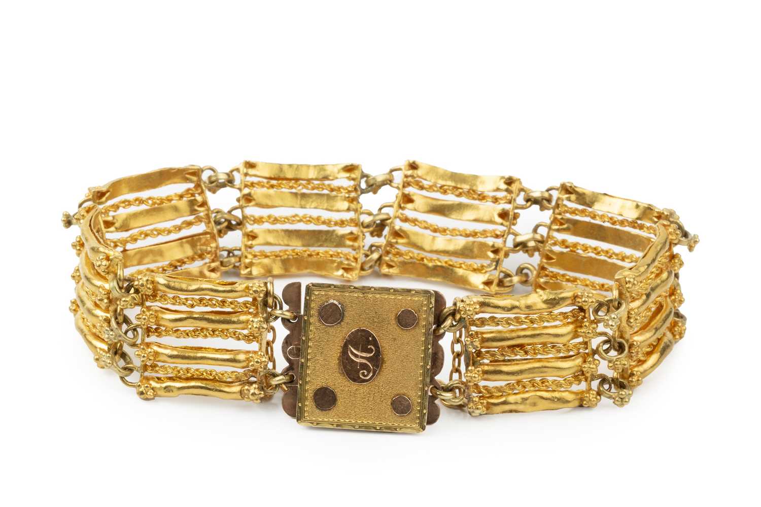 Lot 166 - A Continental yellow metal bracelet, of shaped...