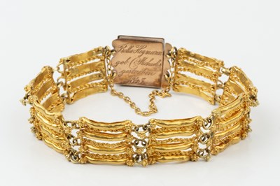 Lot 166 - A Continental yellow metal bracelet, of shaped...