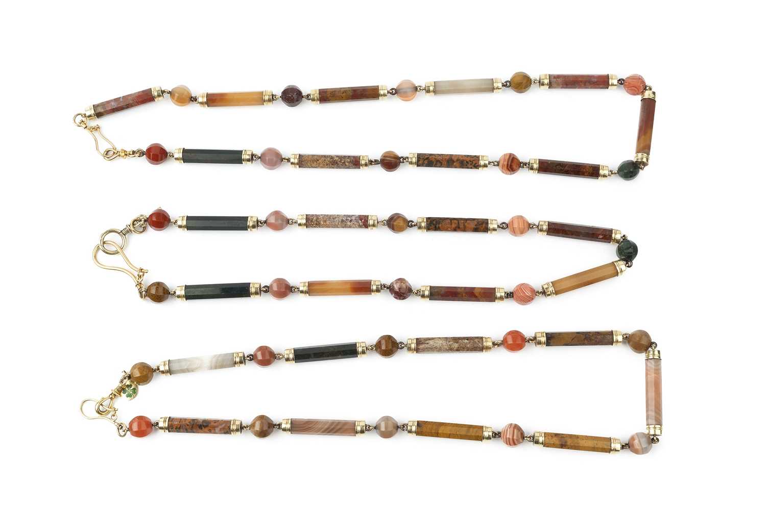 Lot 169 - Three yellow metal mounted Scottish hardstone...