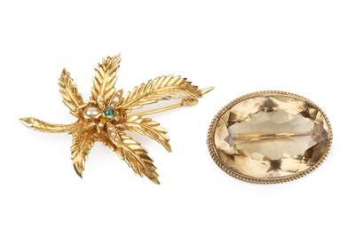 Lot 200 - A 9ct gold and gem set brooch, in the form of...