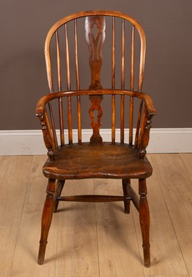 Lot 303 - An elm seated Windsor chair by George Nicolson Rockely