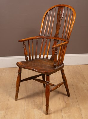 Lot 303 - An elm seated Windsor chair by George Nicolson Rockely