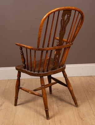 Lot 303 - An elm seated Windsor chair by George Nicolson Rockely