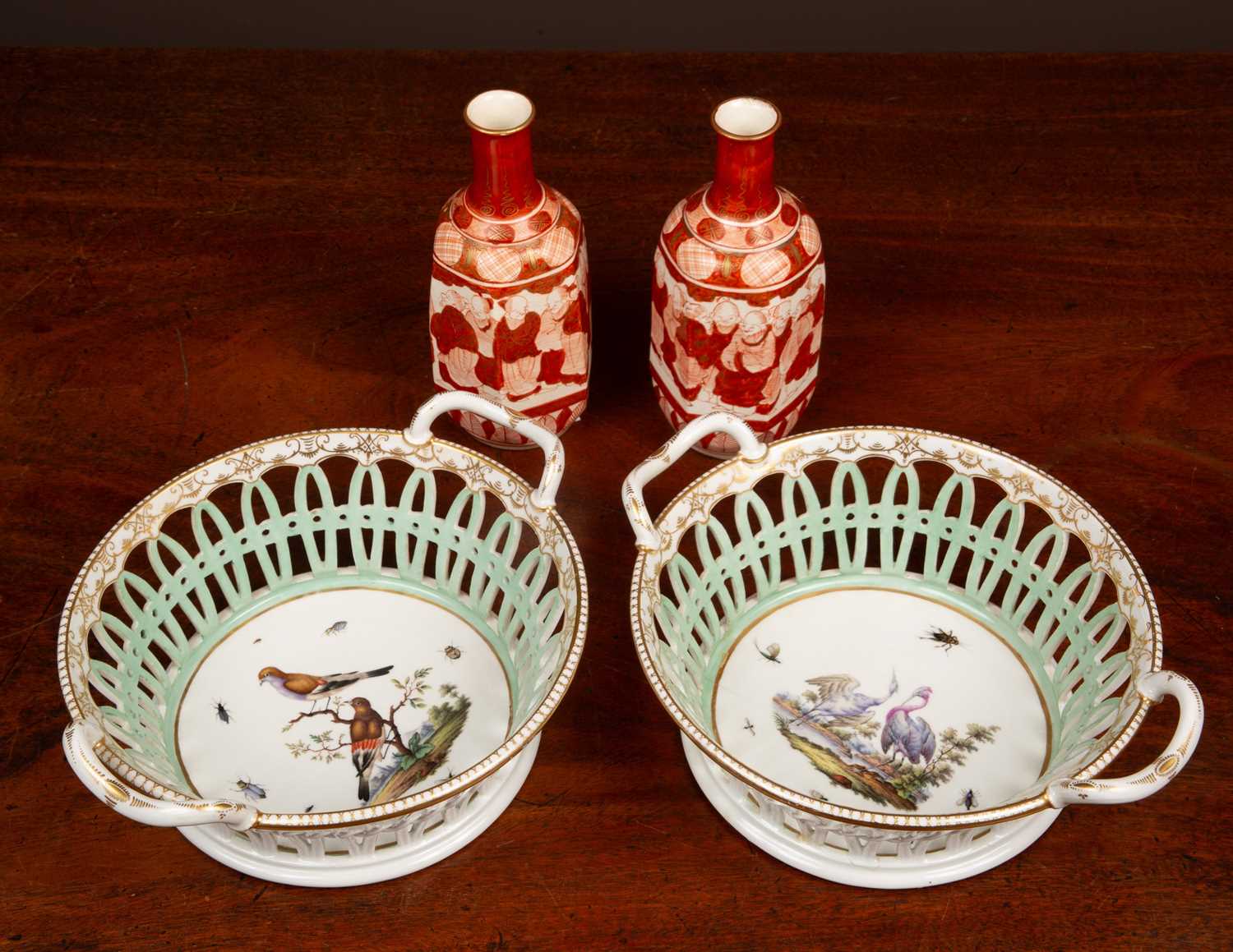 Lot 61 - A pair of 19th century German porcelain chestnut baskets together with a pair of Kutani vases