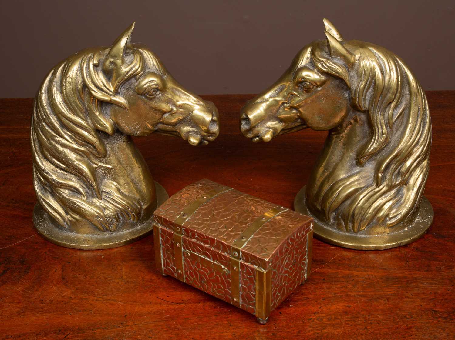 Lot 62 - A pair of heavy brass horse head door stops