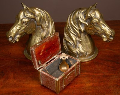 Lot 62 - A pair of heavy brass horse head door stops together with a copper tea caddy