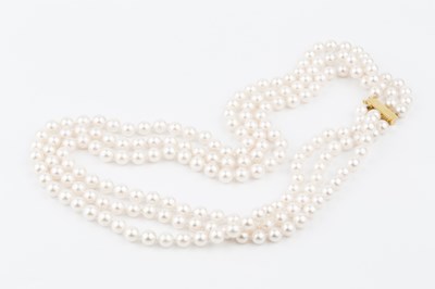 Lot 212 - A triple strand uniform cultured pearl...