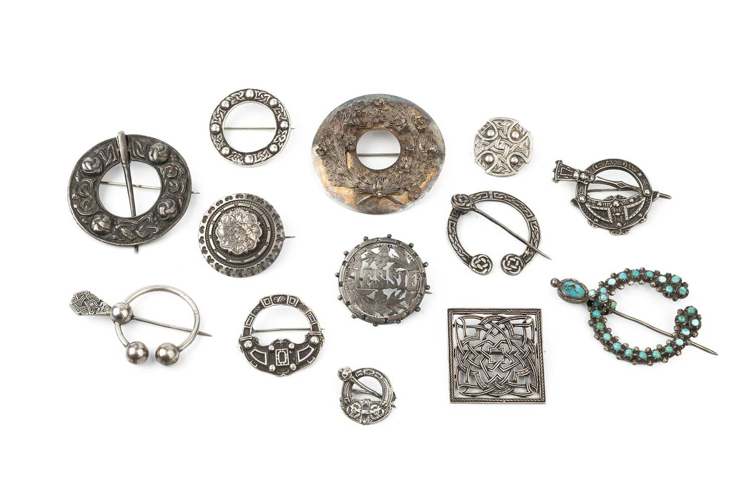 Lot 177 - A collection of five silver circular Celtic...