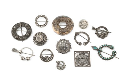 Lot 177 - A collection of five silver circular Celtic...