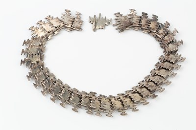 Lot 179 - A silver collar necklace by Anthony Hawksley,...