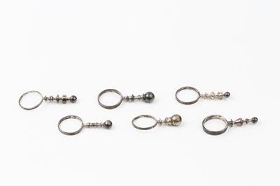 Lot 181 - A set of six silver pillar rings by Wendy...