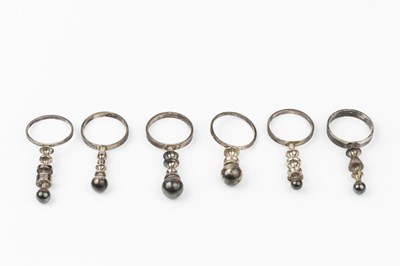 Lot 181 - A set of six silver pillar rings by Wendy...