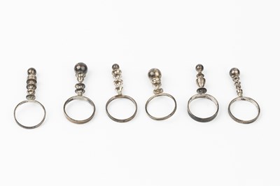 Lot 181 - A set of six silver pillar rings by Wendy...