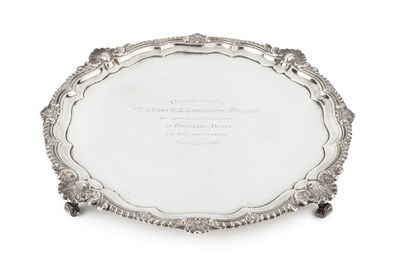 Lot 868 - An Edwardian silver salver, the shaped and...