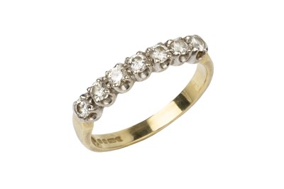 Lot 218 - A diamond dress ring, set with a line of seven...